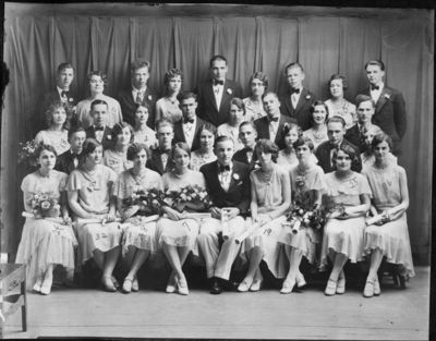 Class of 1930
1st Row: Eugenia M. VandeWalker (Collis), Doris E. White, Mary Emeline Garlick (Comstock), Thelma E. Flagg (Phelps), Bernhard V. Moeller, Doris Quinn (Petrie), Edythe Hillman (Barber), Clara Esther Wafer (Dillon), Sadie M. Miller

2nd Row: Harry Reed, Mabel Seamans (Ferris), Merritt C. Smith, Evelyn G. Bolcum, Roy R. Miller, Agnes Burns, Robert C. Williams, Elmina D. Walker

3rd Row: Ella S. Owen (Henley), Robert J. Whipple, Audrey P. Bell (Eiffe), Stanley M. Kent, Merle Austin (Osuna), John D. Gifford, Thelma Lillian Empey (Bronk), Robert L. Williams

4th Row: Ernest E. Walker, Verna C. Williams (Faulkner), Gordon L. Sexton, Blanche M. Miller, Harland E. Cole, Hazel I. Leavenworth (Barclay), Stanley H. Hughes, Helen Shirley Eaton (Williams), Evan J. Griffith

32 in Class, 34 in photo

2 Extra people in photo:  Agnes Burns (HS Diploma in 1930, Regents Diploma in 1931); Edythe Hillman (Barber) (School Diploma in January 1931)   

